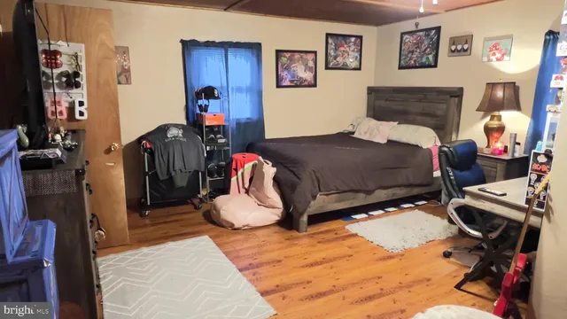 a bedroom with bed and a closet