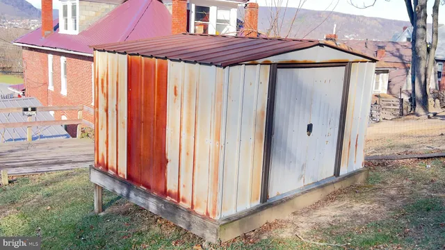 a view of a patio with a table and chairs