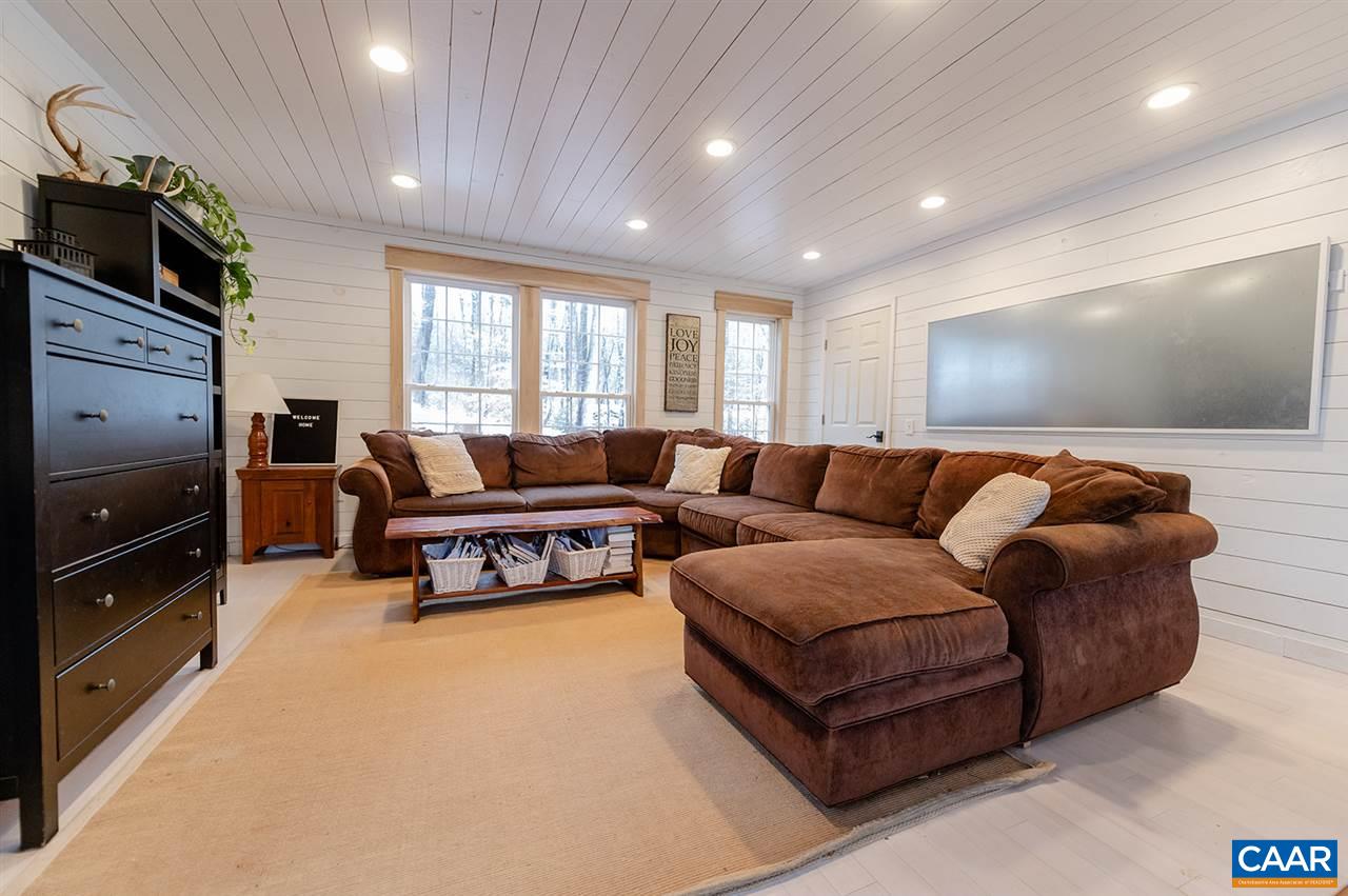 3683 Irish Road Esmont, VA 22937 - Photo 16 of 42 a living room with furniture and a flat screen tv