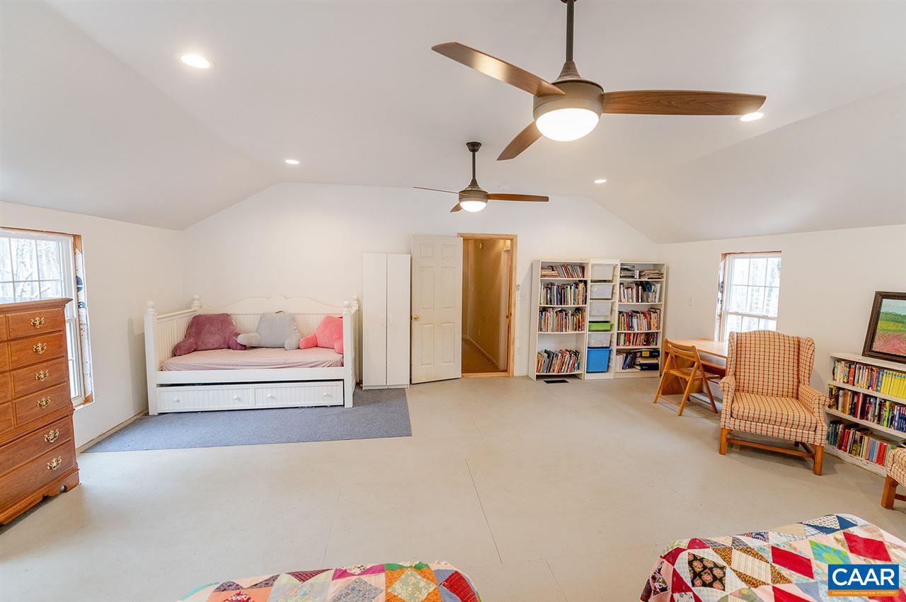 3683 Irish Road Esmont, VA 22937 - Photo 27 of 42 a living room with furniture and a ceiling fan