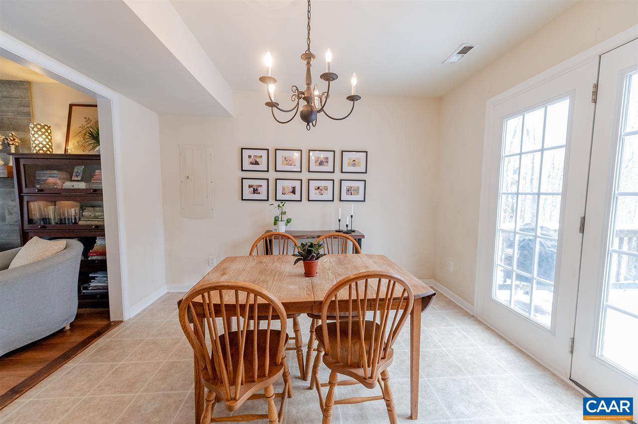 3683 Irish Road Esmont, VA 22937 - Photo 8 of 42 a view of a dining room with furniture wooden floor and chandelier
