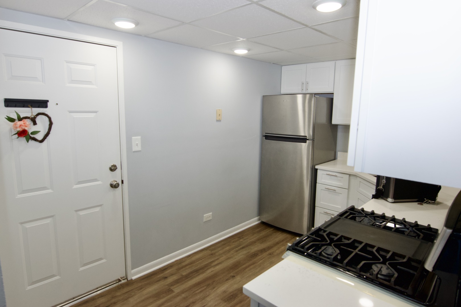 10347 Dearlove Road, Unit 301 Glenview, IL 60025 - Photo 6 of 13 a kitchen with a refrigerator and a stove