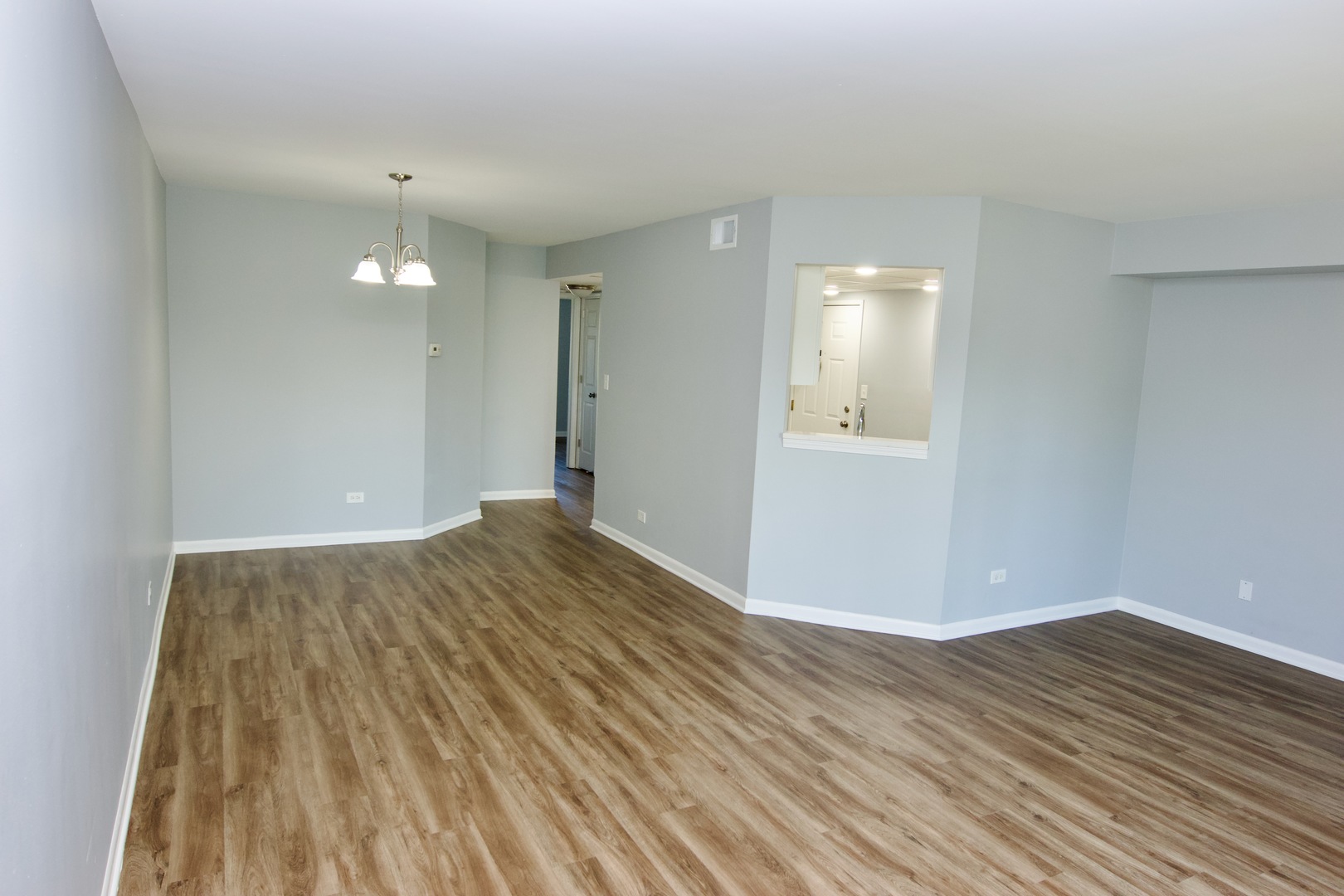 10347 Dearlove Road, Unit 301 Glenview, IL 60025 - Photo 8 of 13 a view of empty room with wooden floor