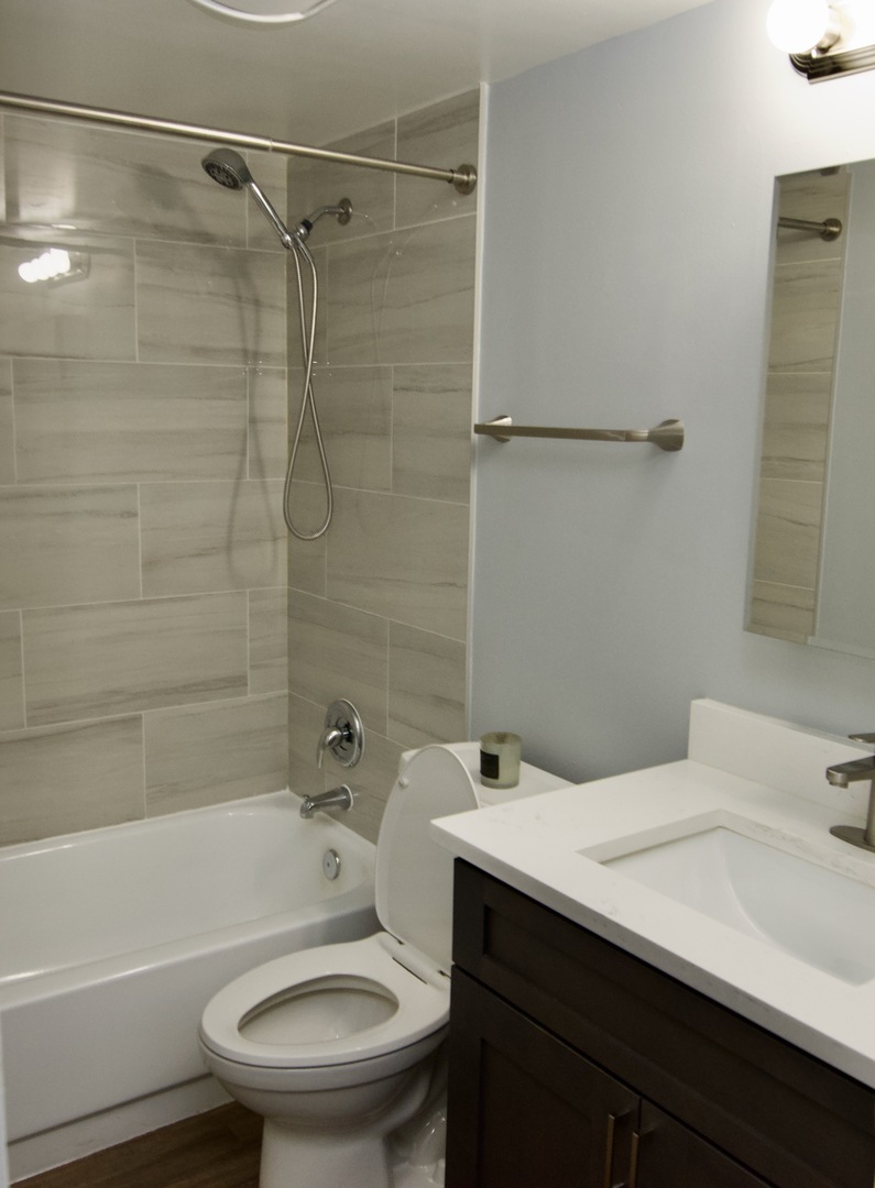 10347 Dearlove Road, Unit 301 Glenview, IL 60025 - Photo 9 of 13 a bathroom with a sink toilet and shower