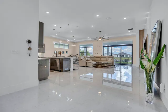 a white bath tub sitting in a bathroom and mirror
