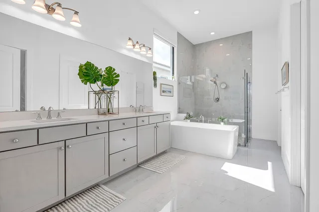 a view of walk in closet with clothes