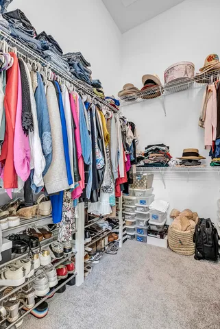 a view of a yard with furniture and garden