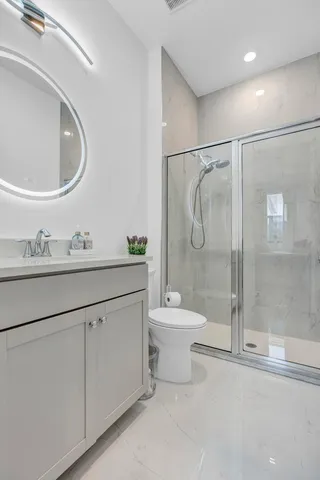 an aerial view of a city and lake view