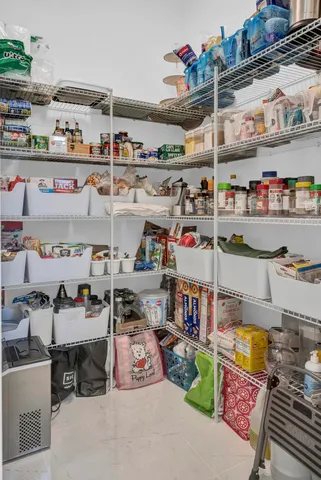an aerial view of residential house with outdoor space and swimming pool