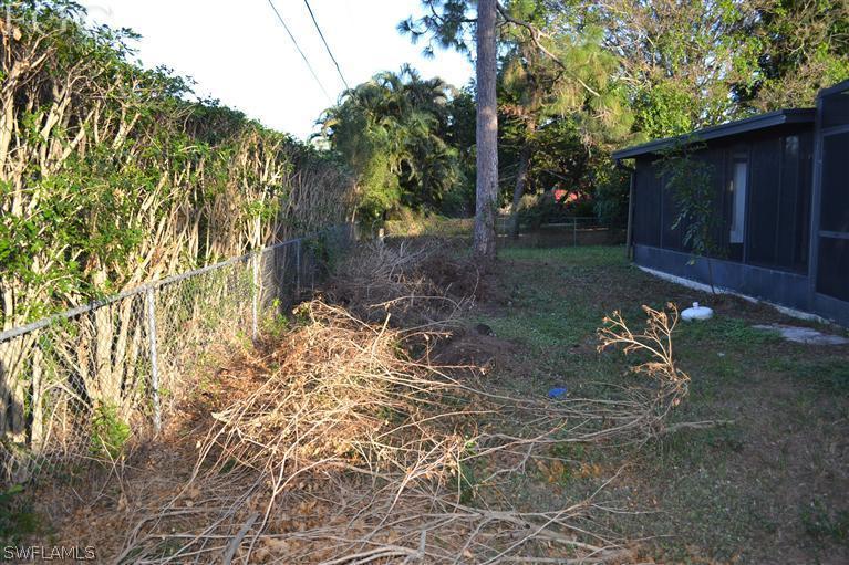 9185 Pomelo Road East Fort Myers, FL 33967 - Photo 7 of 13 a backyard of a house with lots of green space