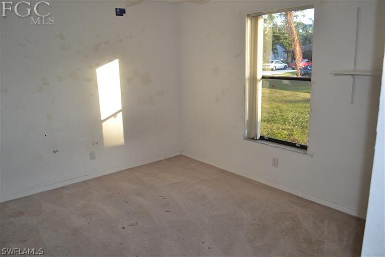 9185 Pomelo Road East Fort Myers, FL 33967 - Photo 10 of 13 an empty room with windows