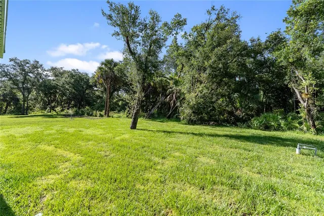 a kitchen with a sink cabinets and a window