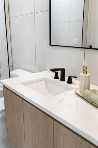 an empty room with a window and wooden floor