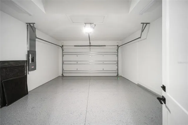 a bathroom with a double vanity sink a toilet and shower