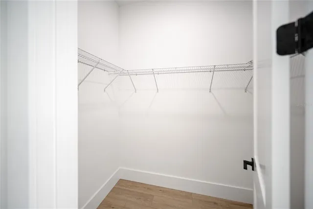 a kitchen with kitchen island a sink stainless steel appliances and cabinets