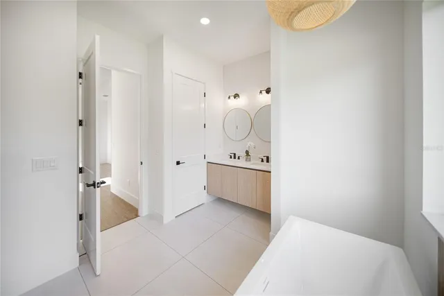 a view of a big room with wooden floor windows and entryway