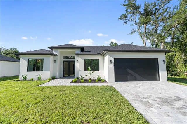 a view of a house with a garden