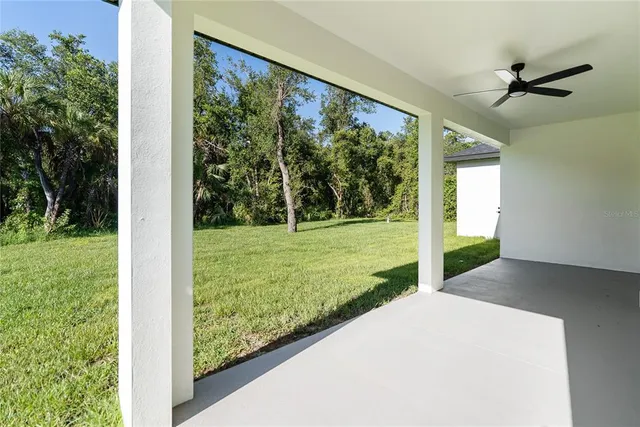 a view of a house with yard and tree s