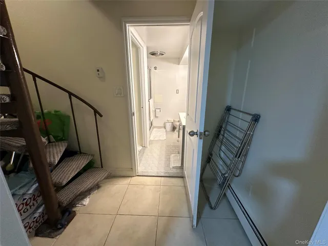 a living room with furniture and white walls