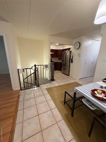 a view of hallway with wooden floor