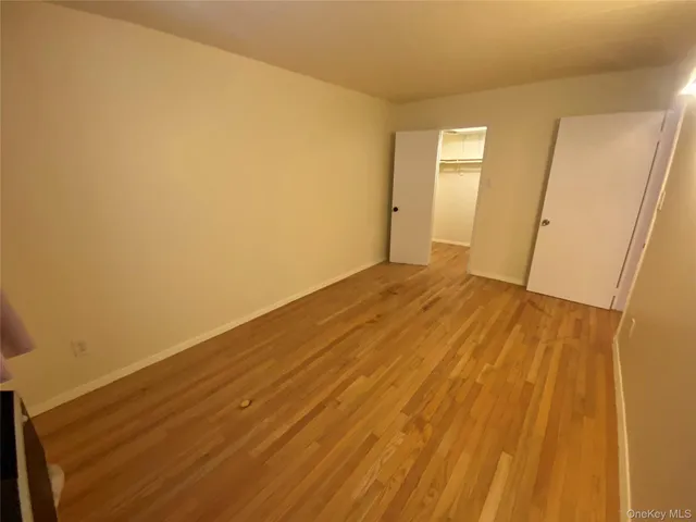 a bed room with a bed and a window