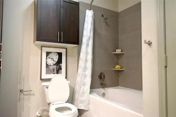 a bathroom with a tub and shower