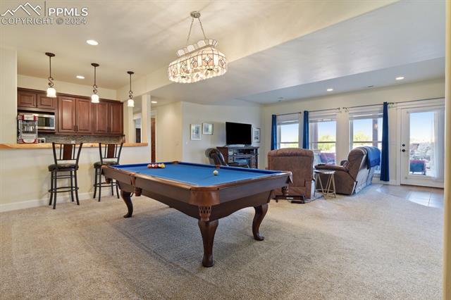 12810 Holmes Road Colorado Springs, CO 80908 - Photo 23 of 45 Game room with pool table and light colored carpet