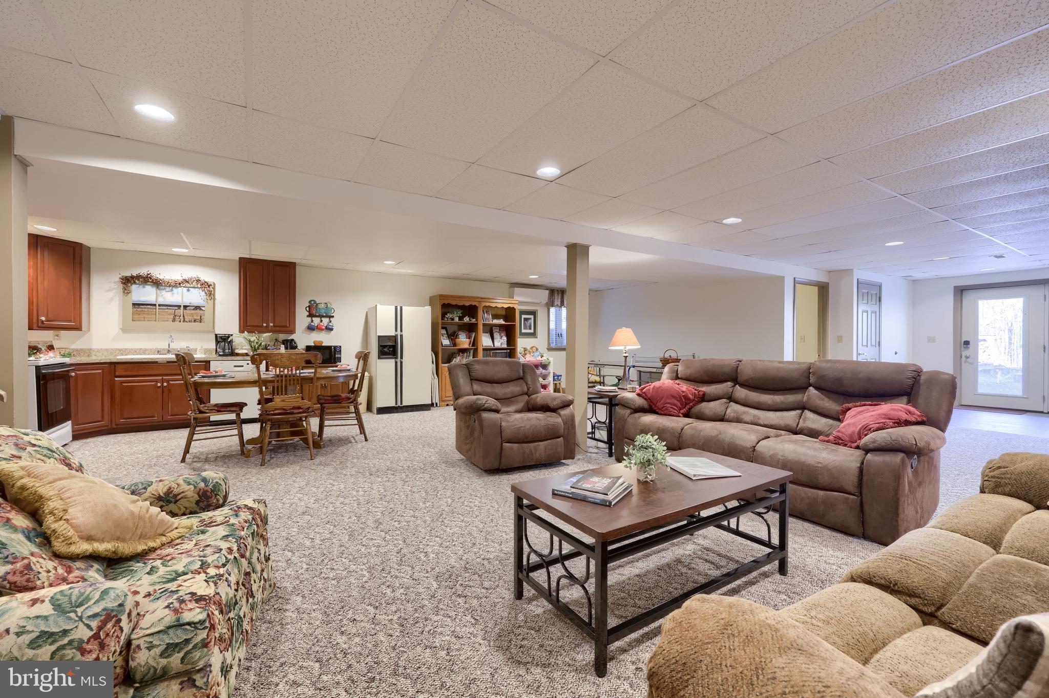 1624 Springville Road New Holland, PA 17557 - Photo 65 of 85 a living room with furniture and a dining table with kitchen view