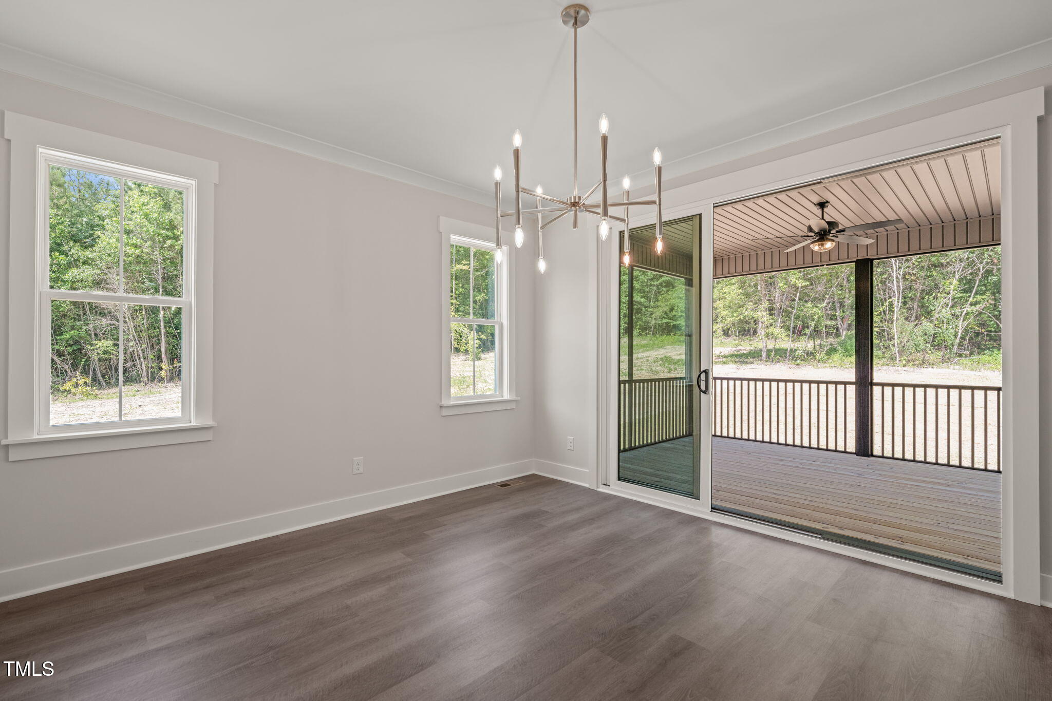 260 Pilot Ridge Road Zebulon, NC 27597 - Photo 13 of 39 a view of an empty room with wooden floor and a window
