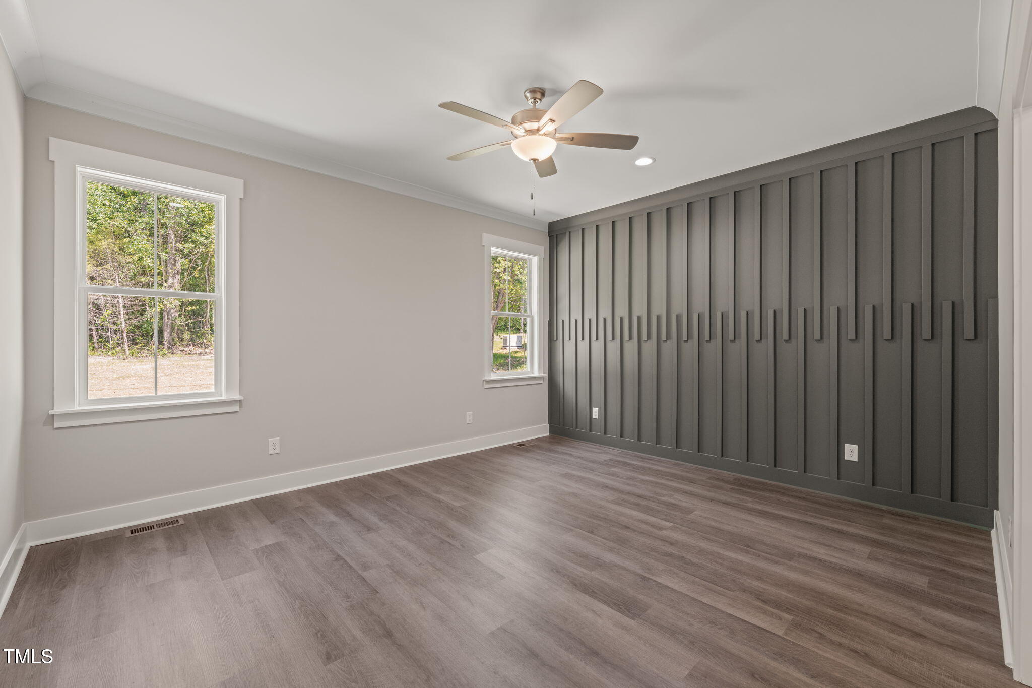260 Pilot Ridge Road Zebulon, NC 27597 - Photo 14 of 39 a view of an empty room with a window and wooden floor