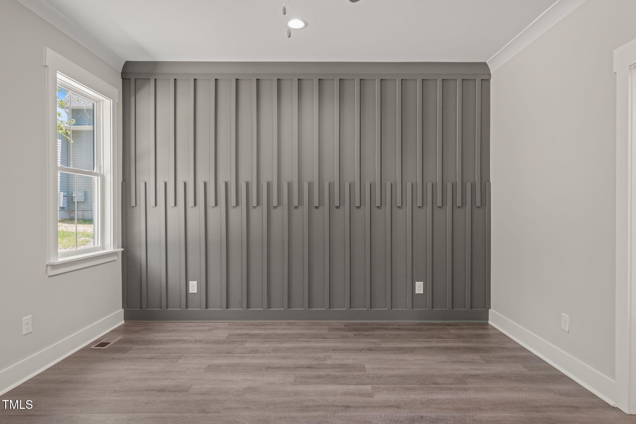 260 Pilot Ridge Road Zebulon, NC 27597 - Photo 15 of 39 an empty room with wooden floor and windows