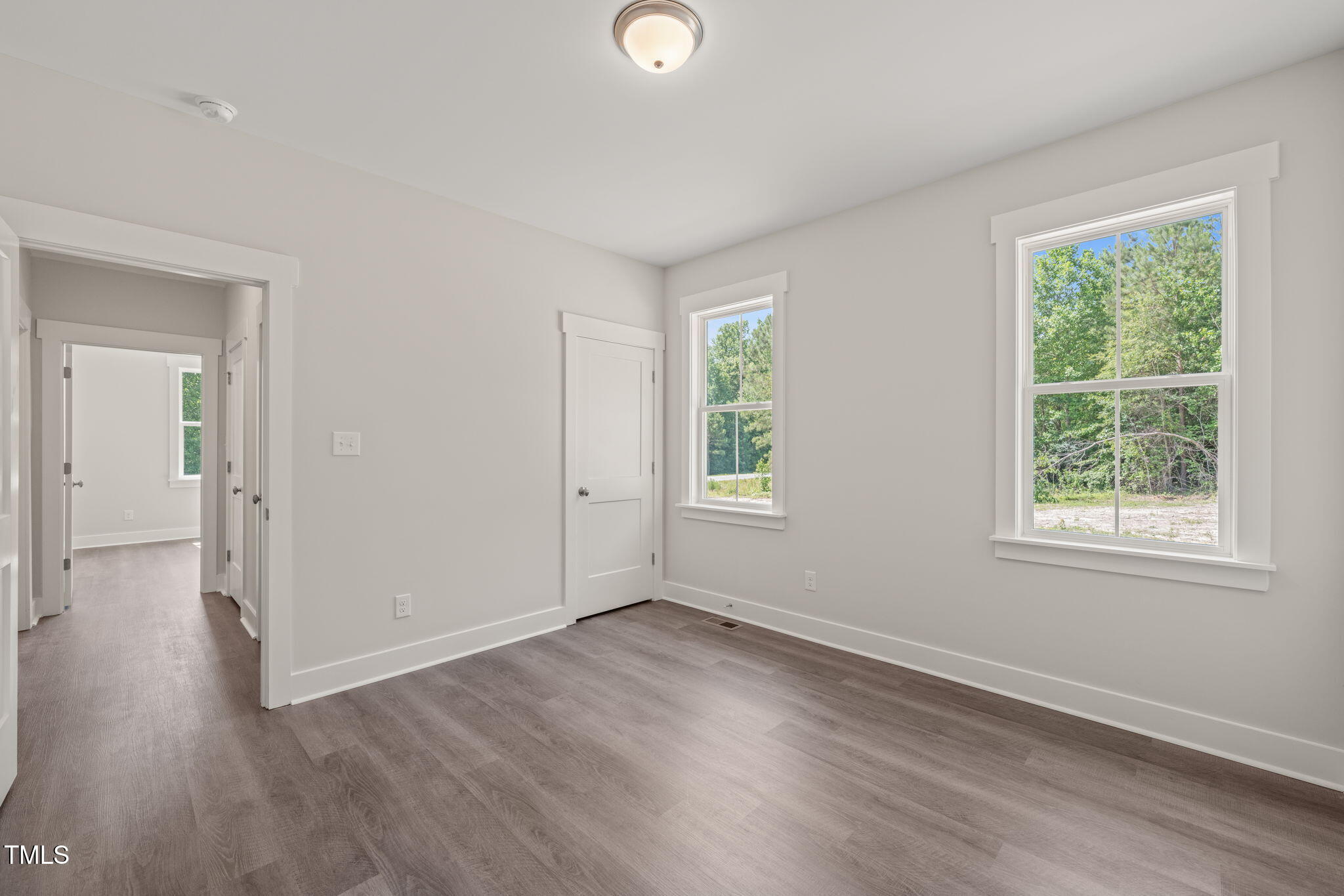 260 Pilot Ridge Road Zebulon, NC 27597 - Photo 23 of 39 an empty room with wooden floor and windows