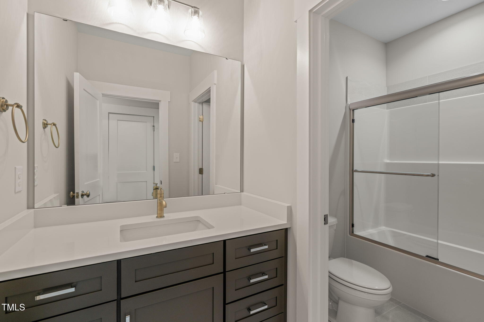 260 Pilot Ridge Road Zebulon, NC 27597 - Photo 24 of 39 a bathroom with a sink a toilet and shower