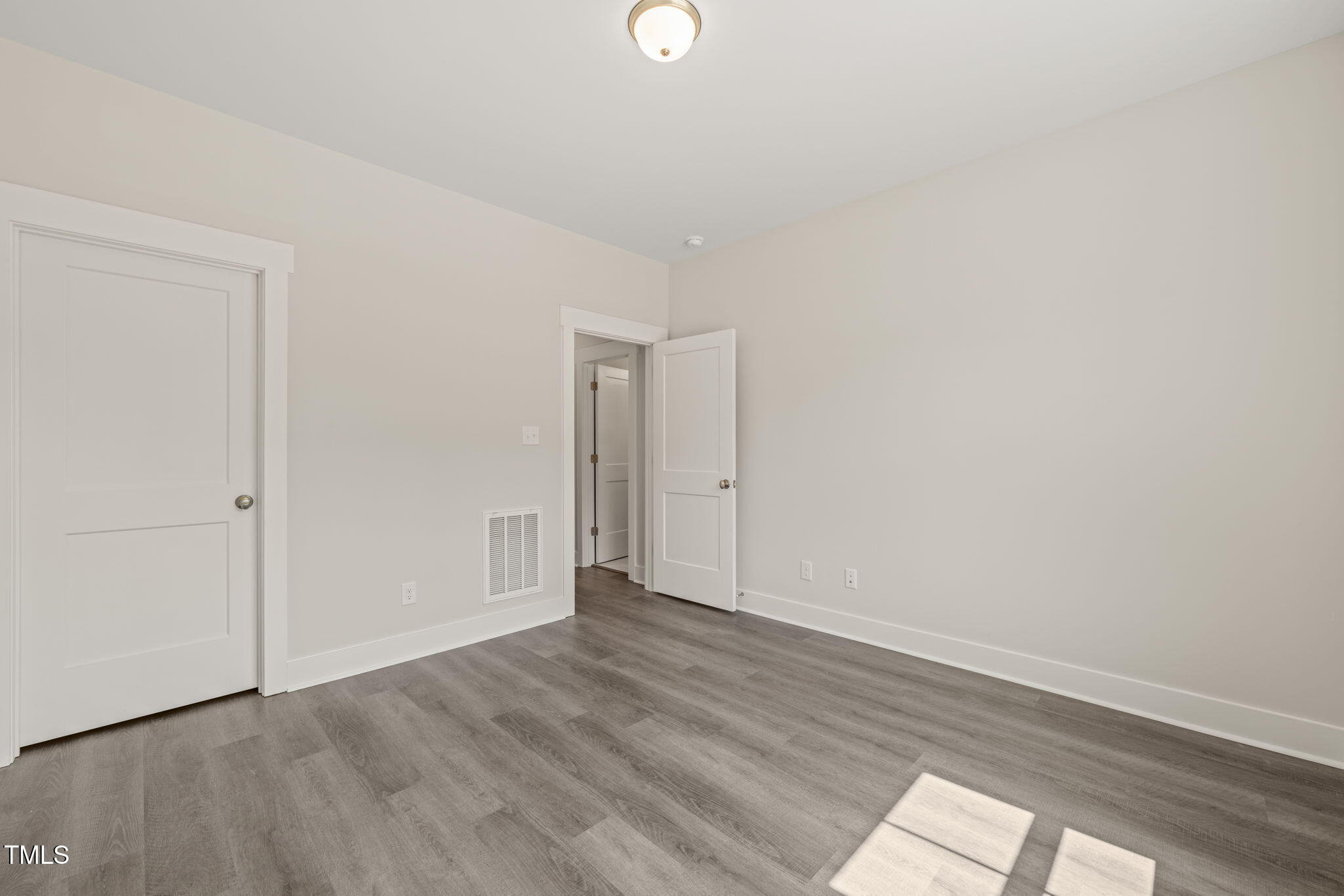 260 Pilot Ridge Road Zebulon, NC 27597 - Photo 26 of 39 a view of an empty room with wooden floor and windows