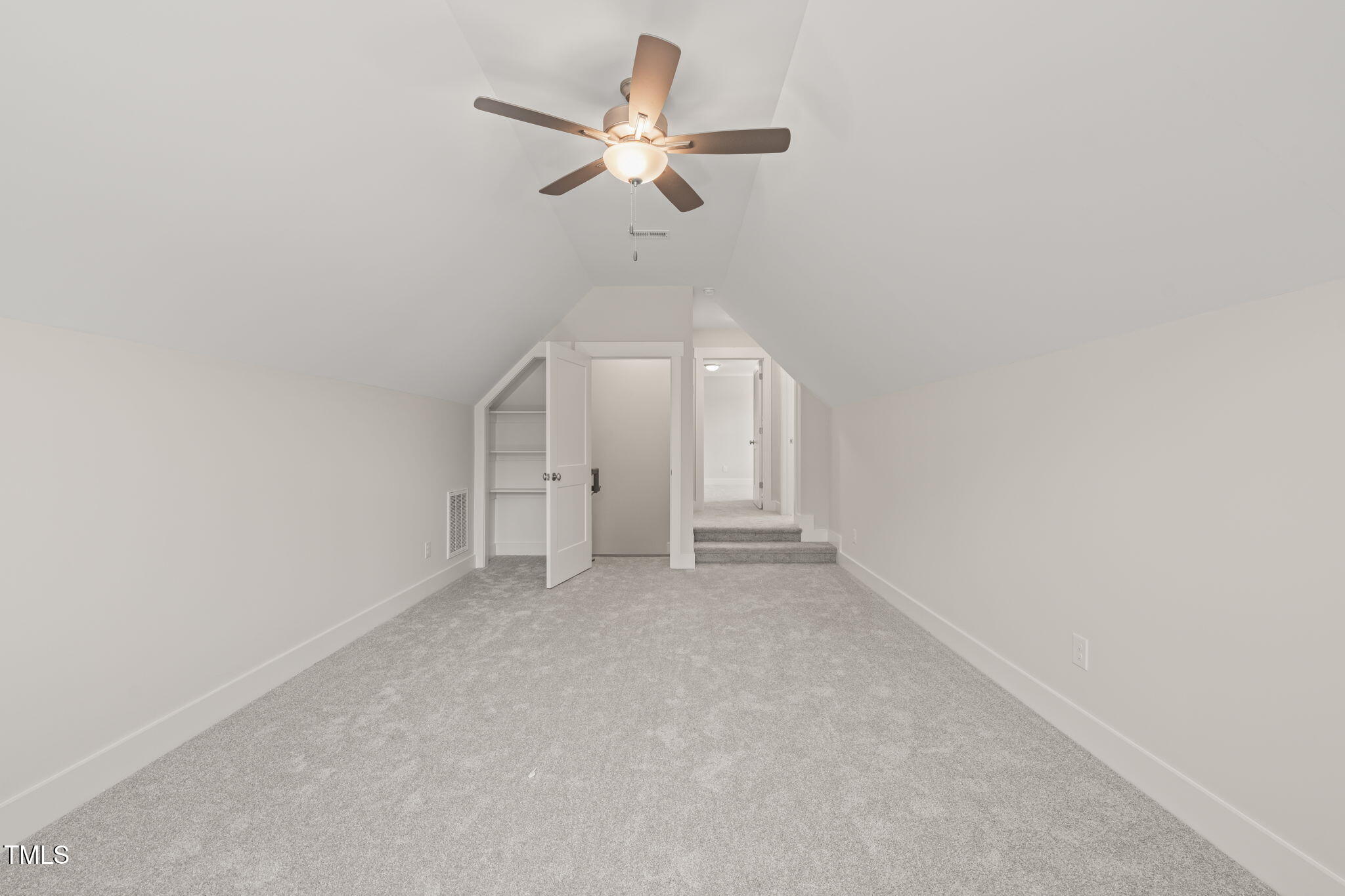 260 Pilot Ridge Road Zebulon, NC 27597 - Photo 31 of 39 an empty room with a ceiling fan and a window