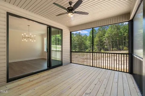a view of a porch with wooden floor and outdoor space