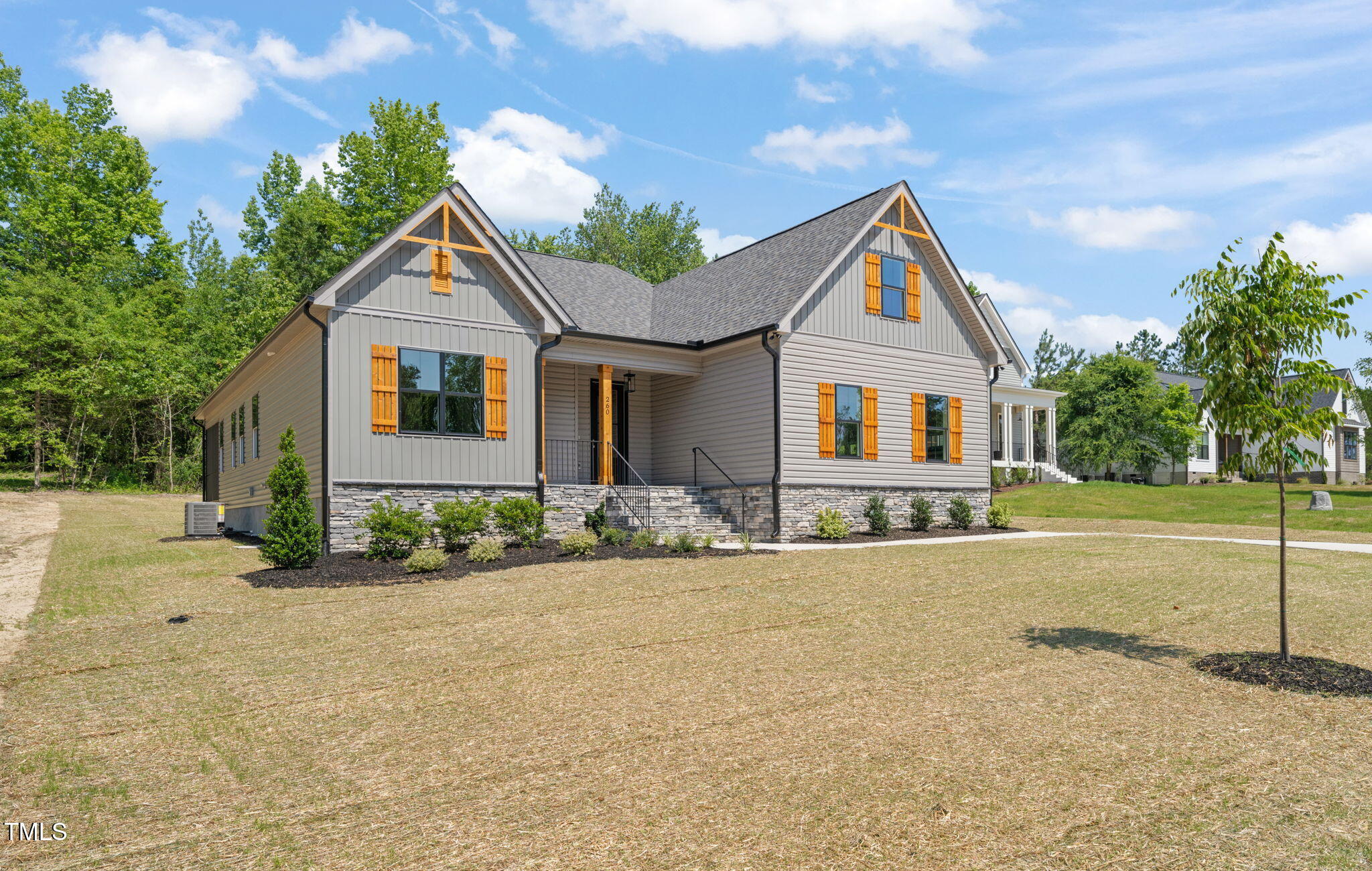 260 Pilot Ridge Road Zebulon, NC 27597 - Photo 36 of 39 a front view of a house with a yard and garage