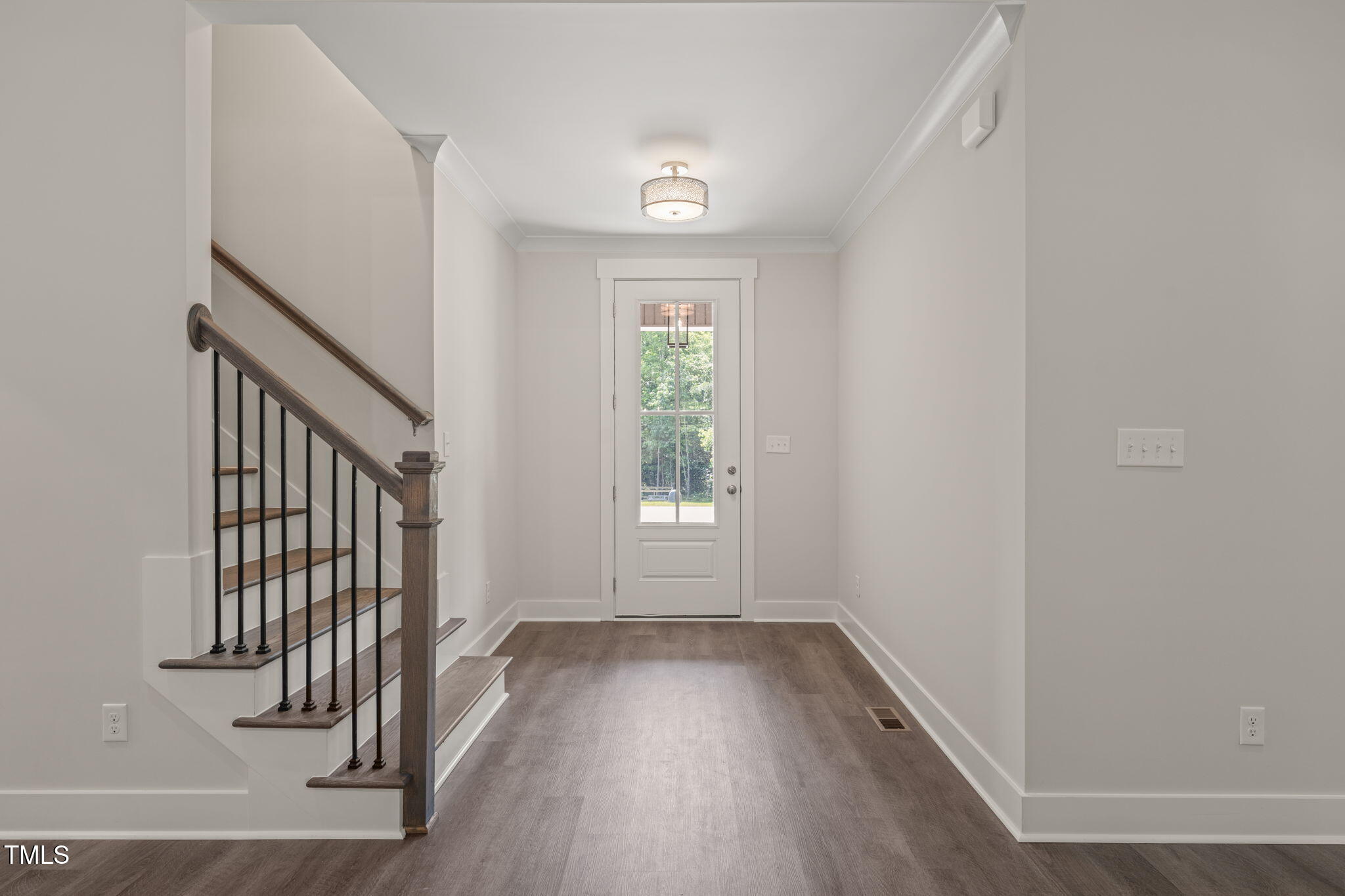 260 Pilot Ridge Road Zebulon, NC 27597 - Photo 4 of 39 an empty room with wooden floor and windows