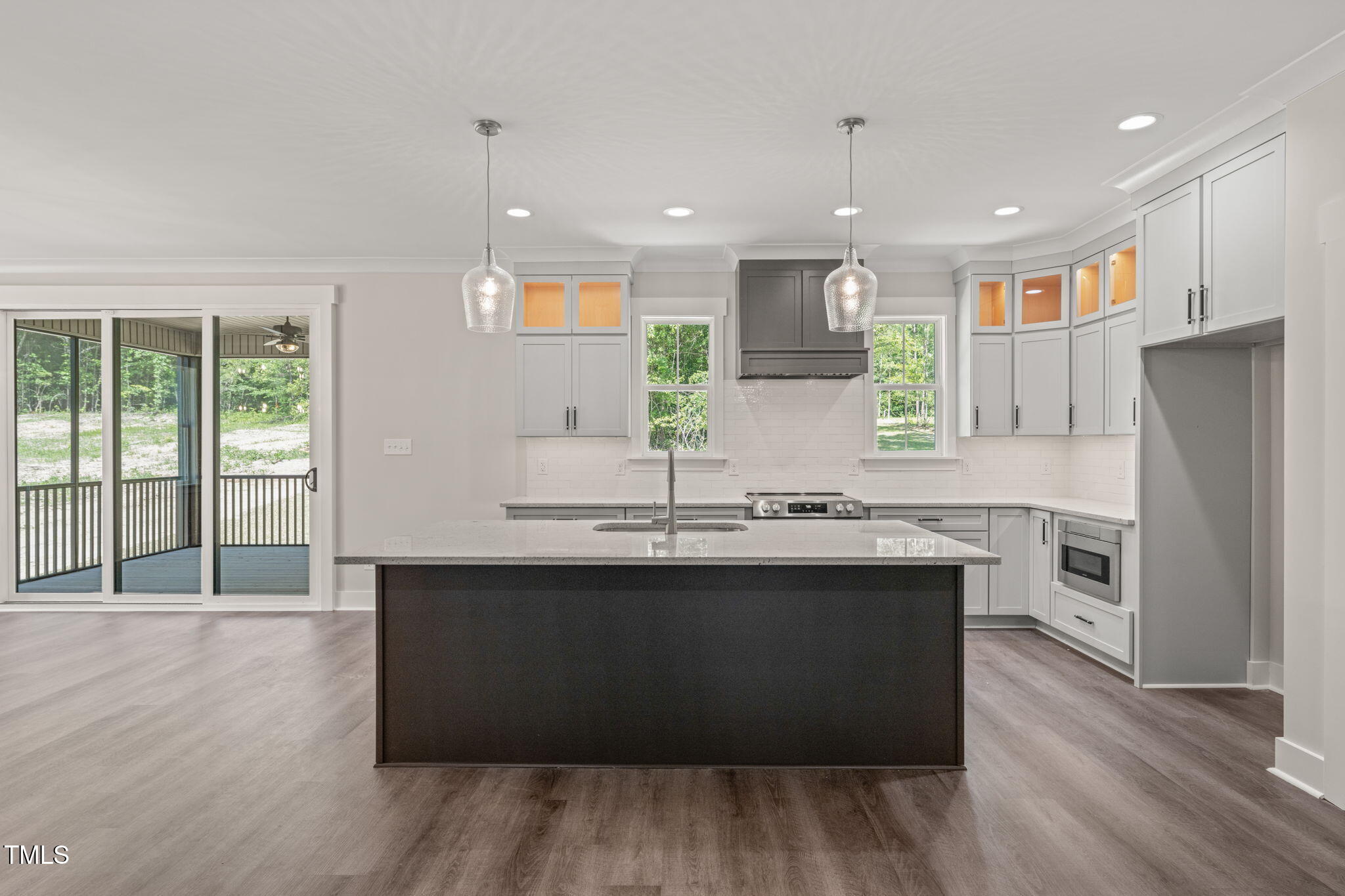 260 Pilot Ridge Road Zebulon, NC 27597 - Photo 8 of 39 a kitchen with kitchen island sink stove and refrigerator