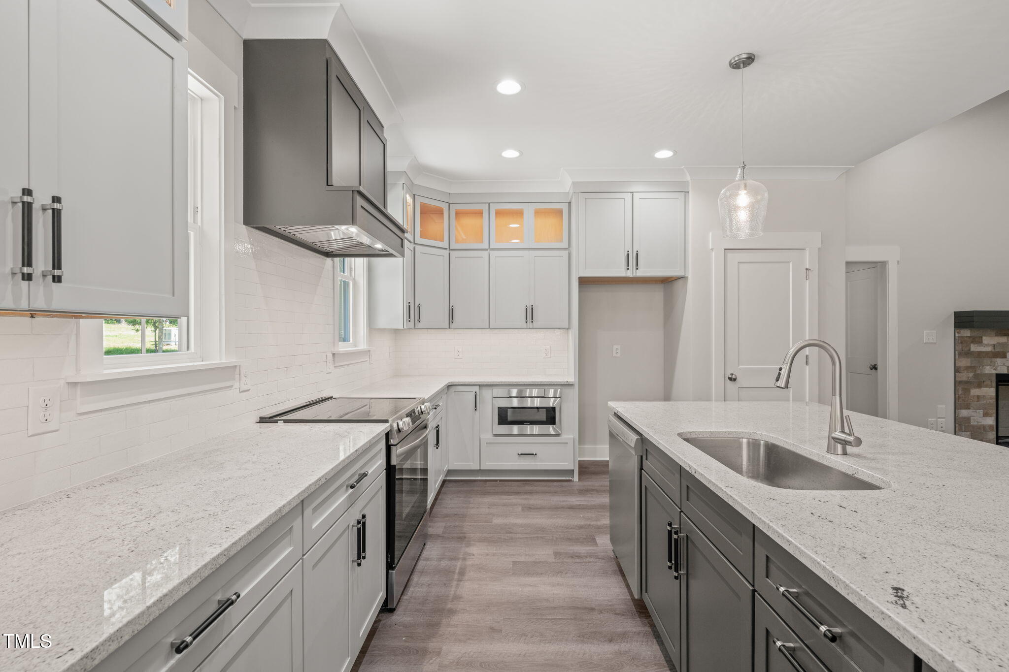 260 Pilot Ridge Road Zebulon, NC 27597 - Photo 10 of 39 a kitchen with stainless steel appliances granite countertop a sink stove and refrigerator
