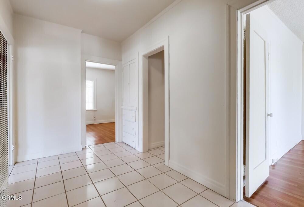 833-835 North Ridgewood Place Los Angeles, CA 90038 - Photo 4 of 28 a view of an empty room and wooden floor
