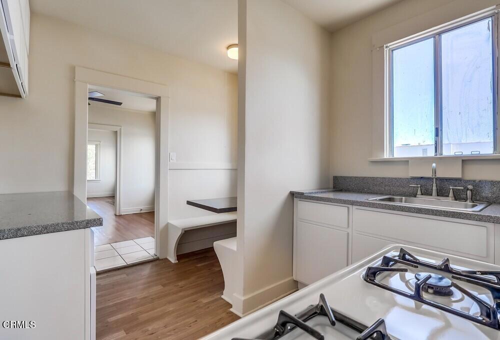 833-835 North Ridgewood Place Los Angeles, CA 90038 - Photo 9 of 28 a bathroom with a sink and a mirror