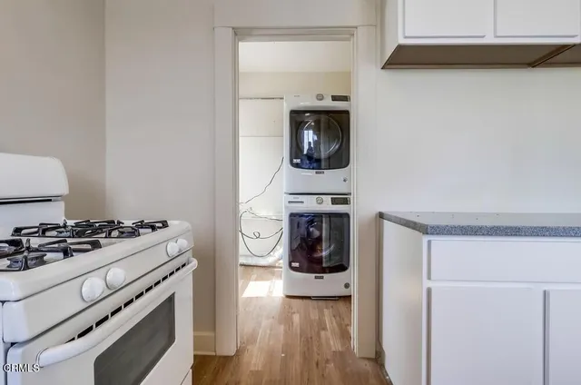 a kitchen with a stove and a refrigerator