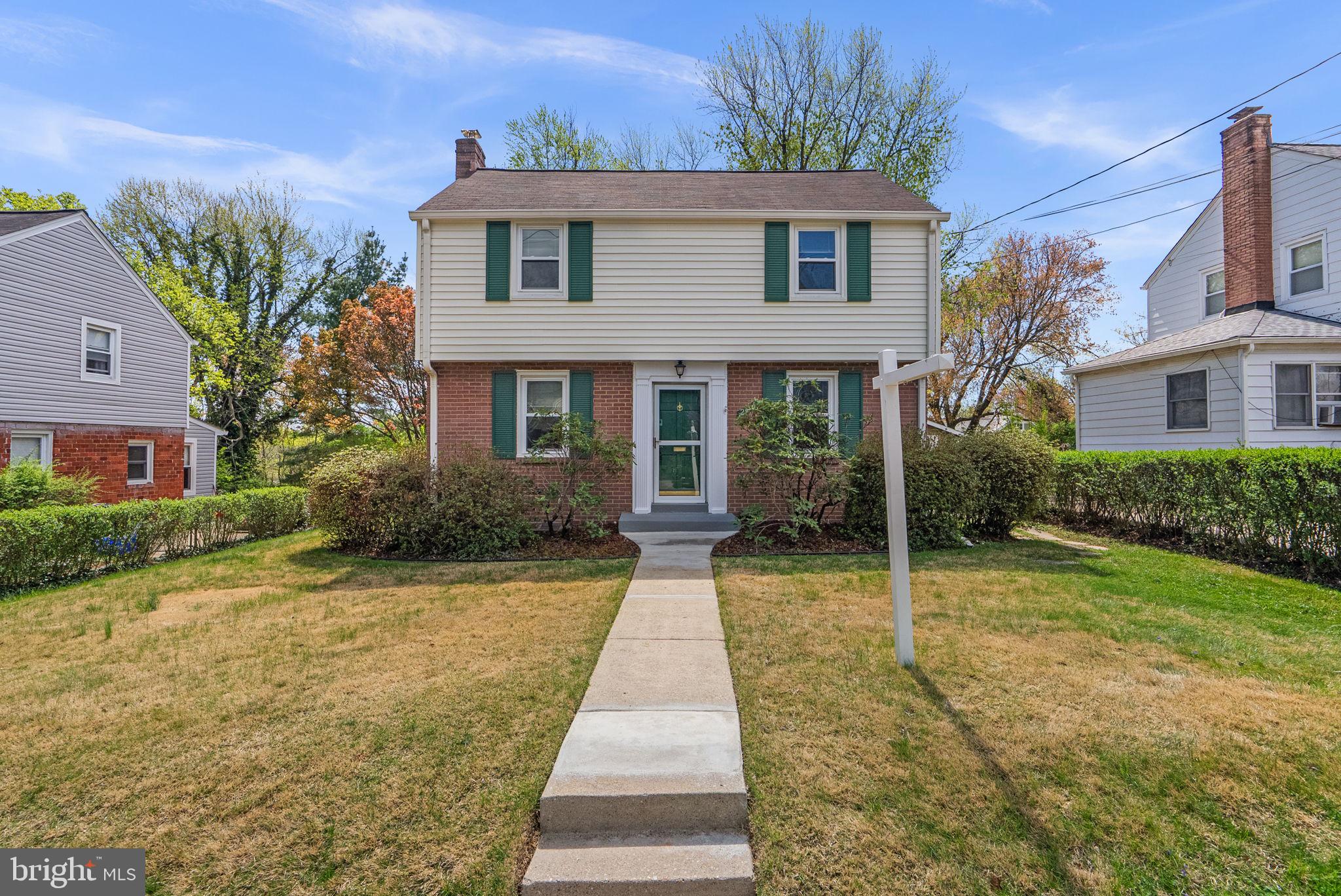 2414 Dexter Avenue Silver Spring, MD 20902 - Photo 1 of 1 a front view of a house with garden
