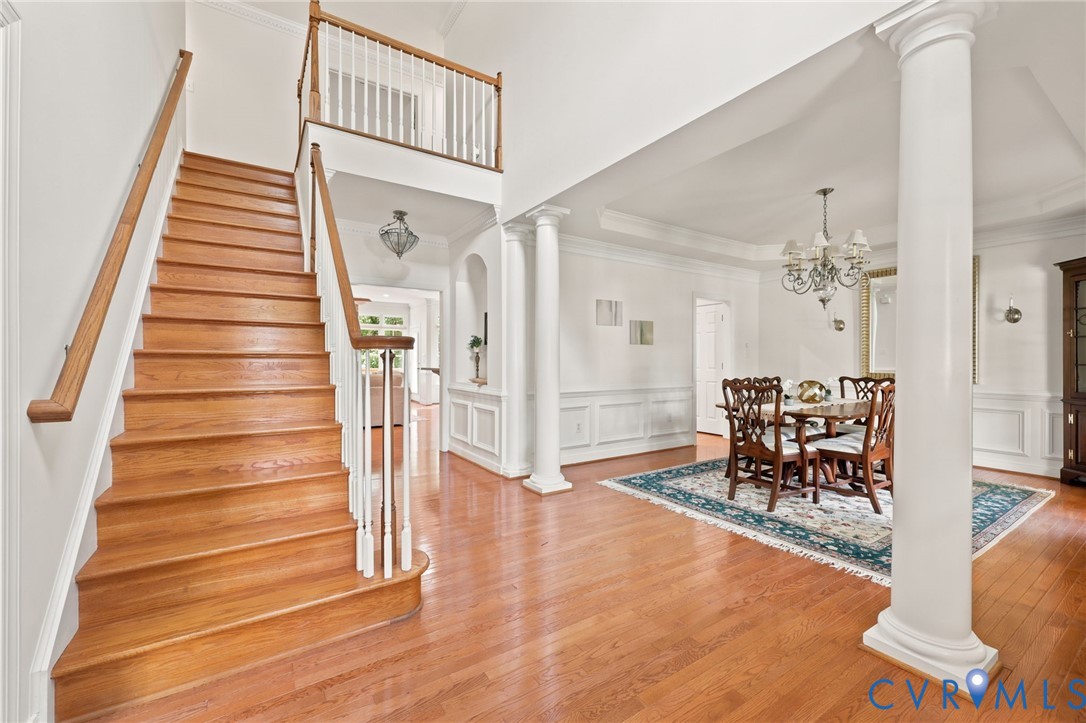 4701 Regal Oaks Road Glen Allen, VA 23059 - Photo 7 of 60 a view of a hallway with dining room and wooden floor