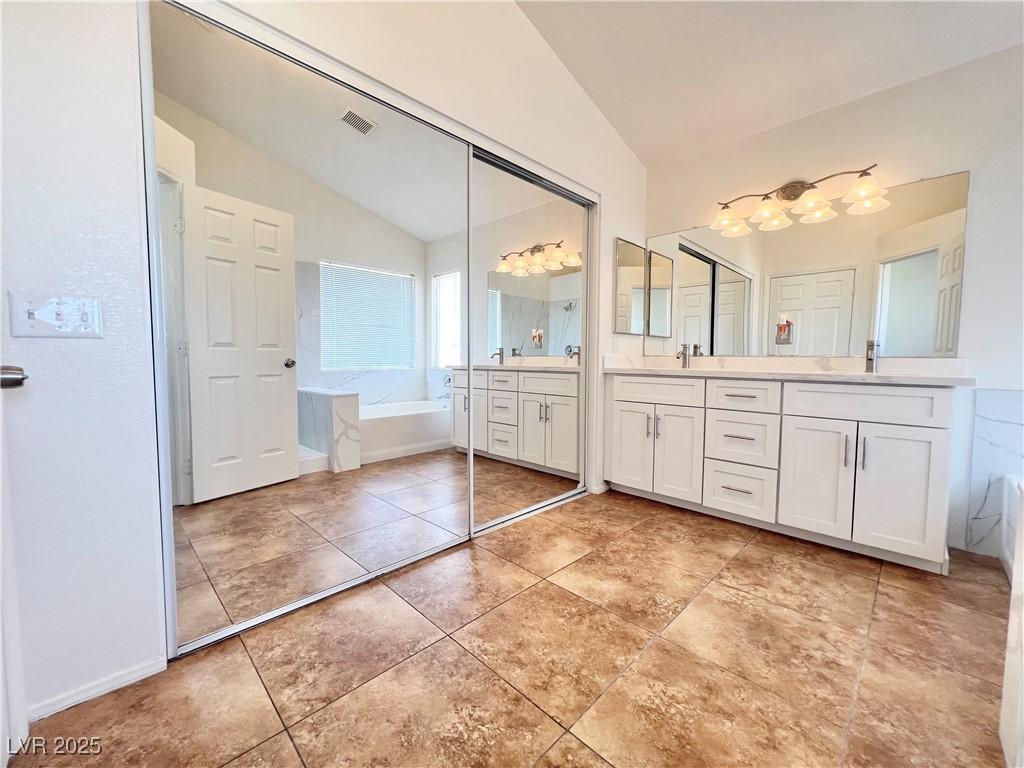330 Forest Ridge Street Henderson, NV 89014 - Photo 21 of 45 Primary bathroom with walk-in closet w/ mirror doors and double sinks