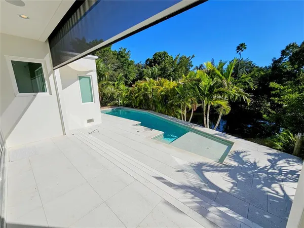 a view of a house with a yard and chair