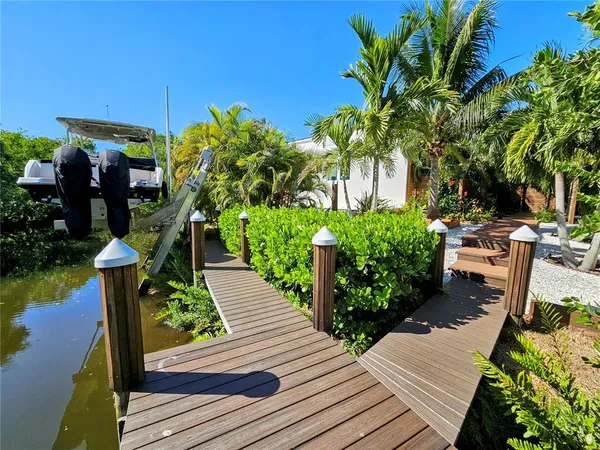 a view of a backyard with sitting area