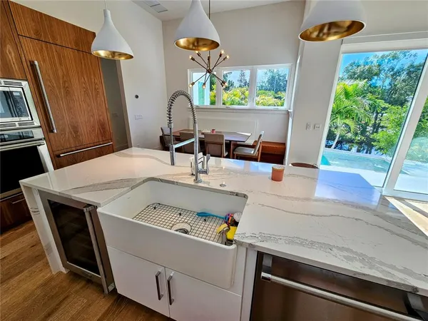 an aerial view of a house with garden space and lake view