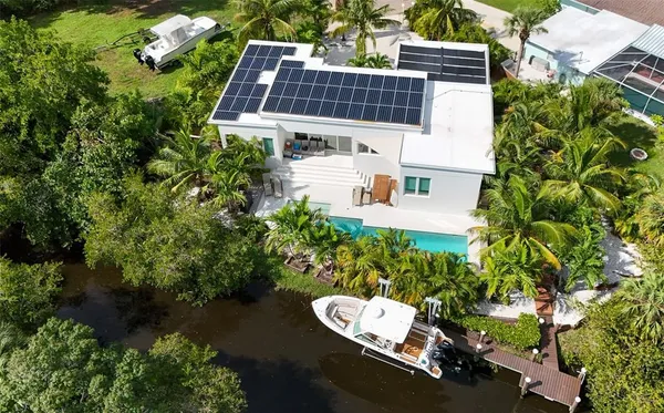 a bed sitting in a bedroom next to a small yard